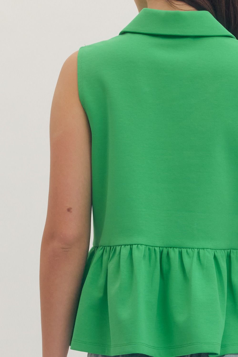 T30057 Solid Sleeveless Peplum Top